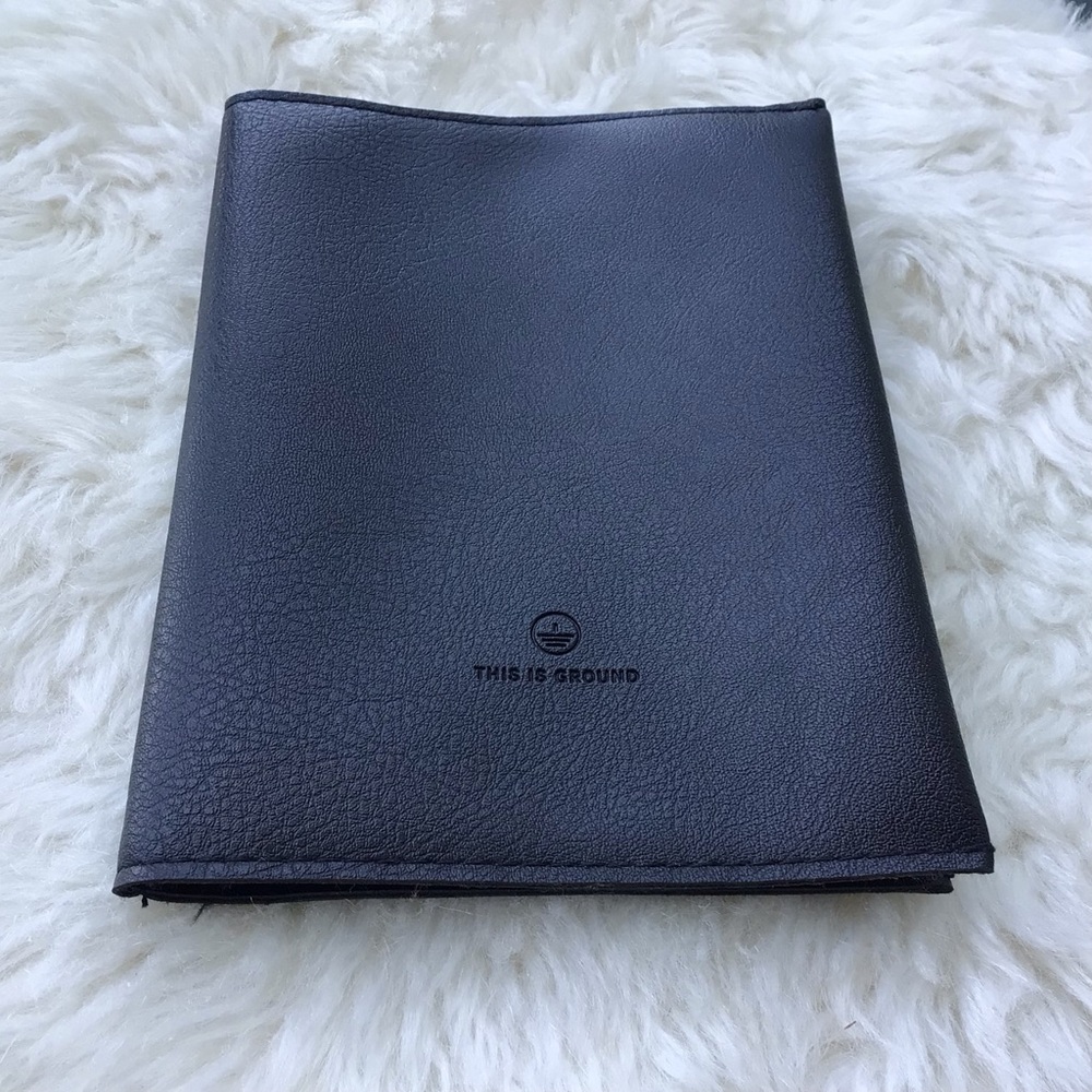 This is Ground All Leather Bi-fold Travel Passport Documents Pouch